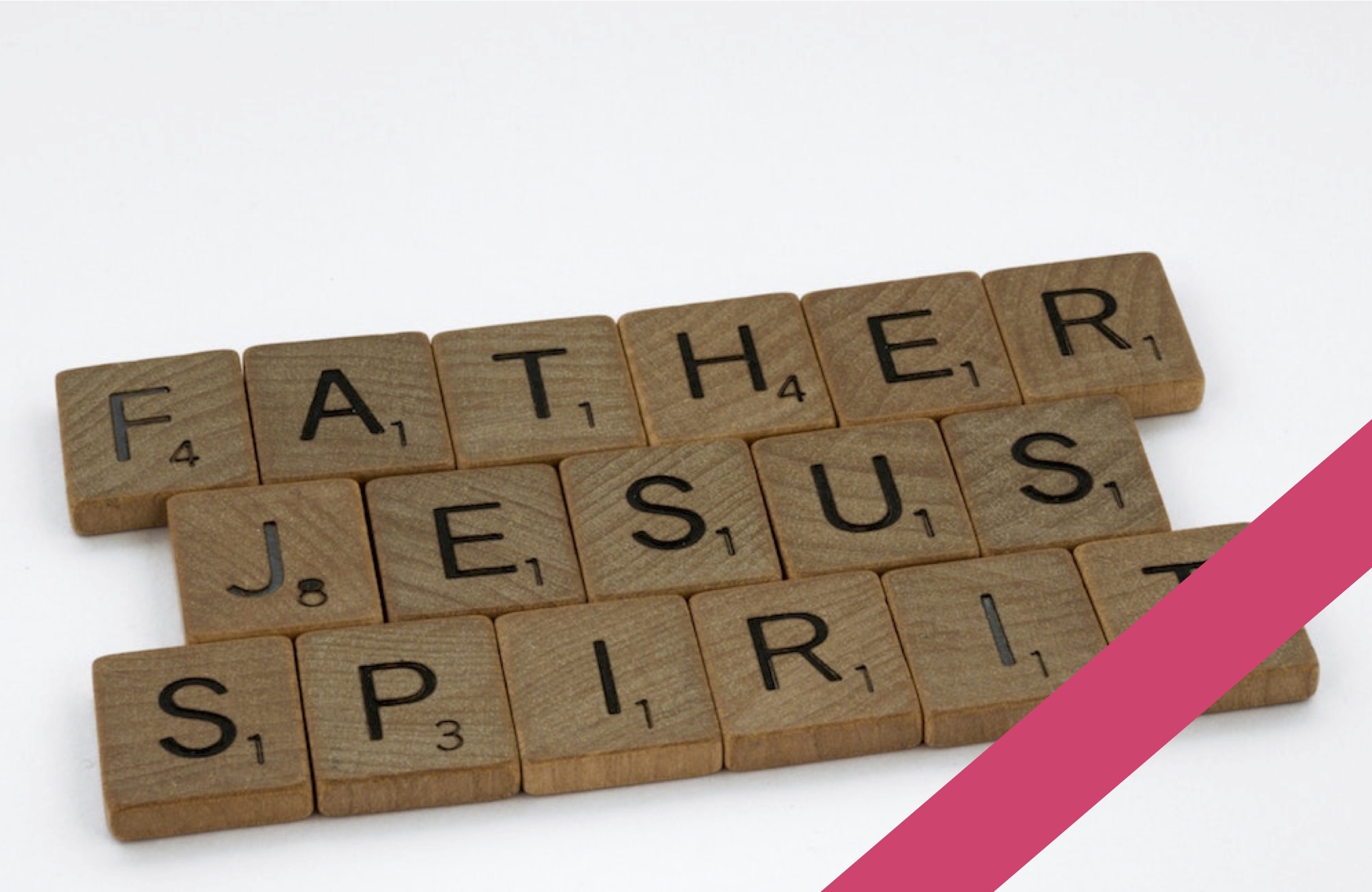 Father, Jesus and Spirit spelled out in Scrabble tiles