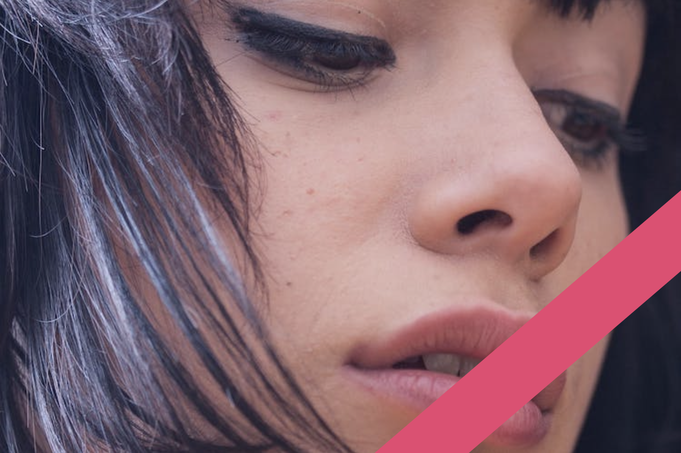 close up of young woman's face, focusing on her lips