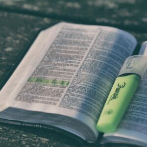 Bible open and verse highlighted with green highlighter