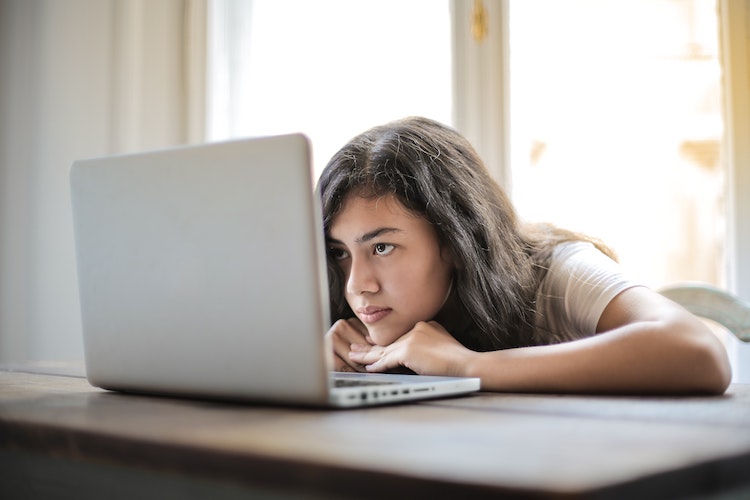 teenager staring at computer screen